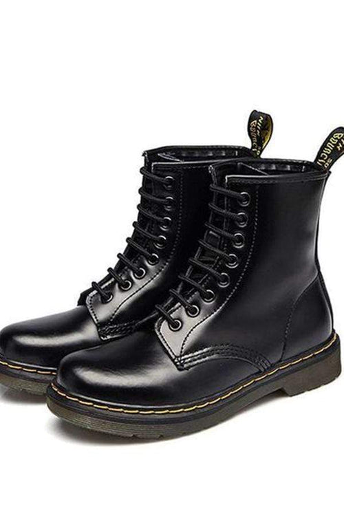 Platta lågklackade brittiska Martin-stövlar i röret Par Korta stövlar i läder 